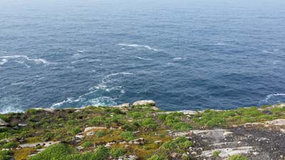 The cliff edge seen here is only a matter of feet from the lighthouse wall. If the wind had carried them over the wall, there was only a very short distance to the edge of the cliff and a sheer drop of almost 300 feet to the sea and rocks below.