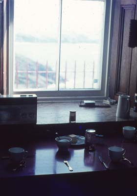 The interior of the Flannans Lighthouse looking out from the kitchen taken in the 1960s.