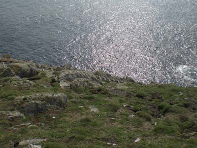 Looking down at the stone where Robert Muirhead said the box of ropes was located (beneath the large stone which here is in the centre of the picture). This is 110ft (34xm) above sea level and is where Muirhead believed the men were swept away from.